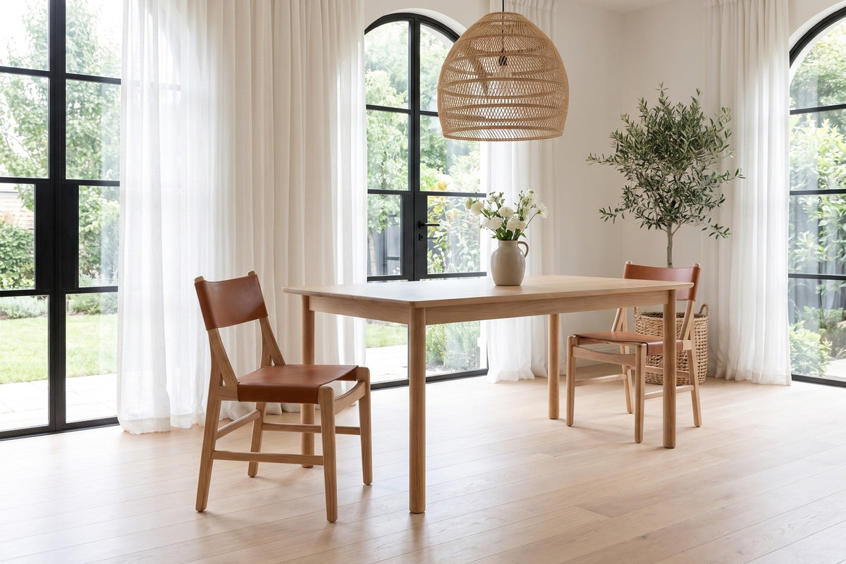 Cassis Leather Sling Dining Chair in a room