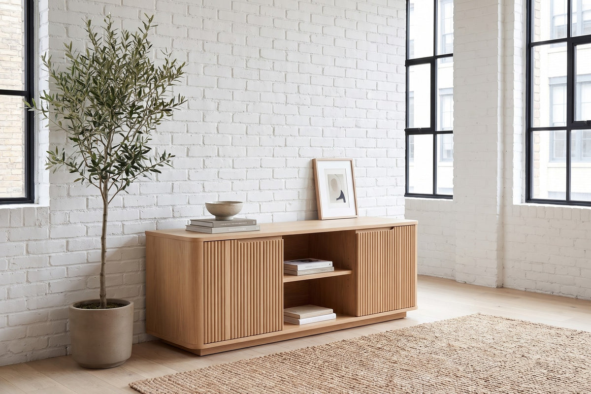Gordes Fluted Oak Media Console in a room