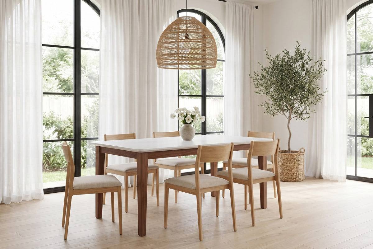 Ménerbes White Quartz and Walnut Dining Table in a room