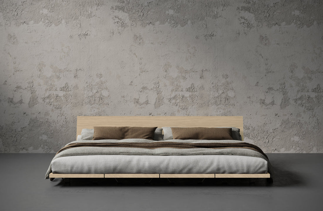 Japandi-style bedroom with a solid wood bed frame in walnut finish and minimal natural-toned decor
