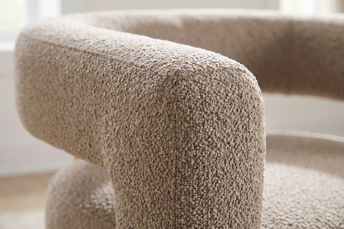 Close-up of the nubby light camel boucle on the rounded arm band (Agathe)