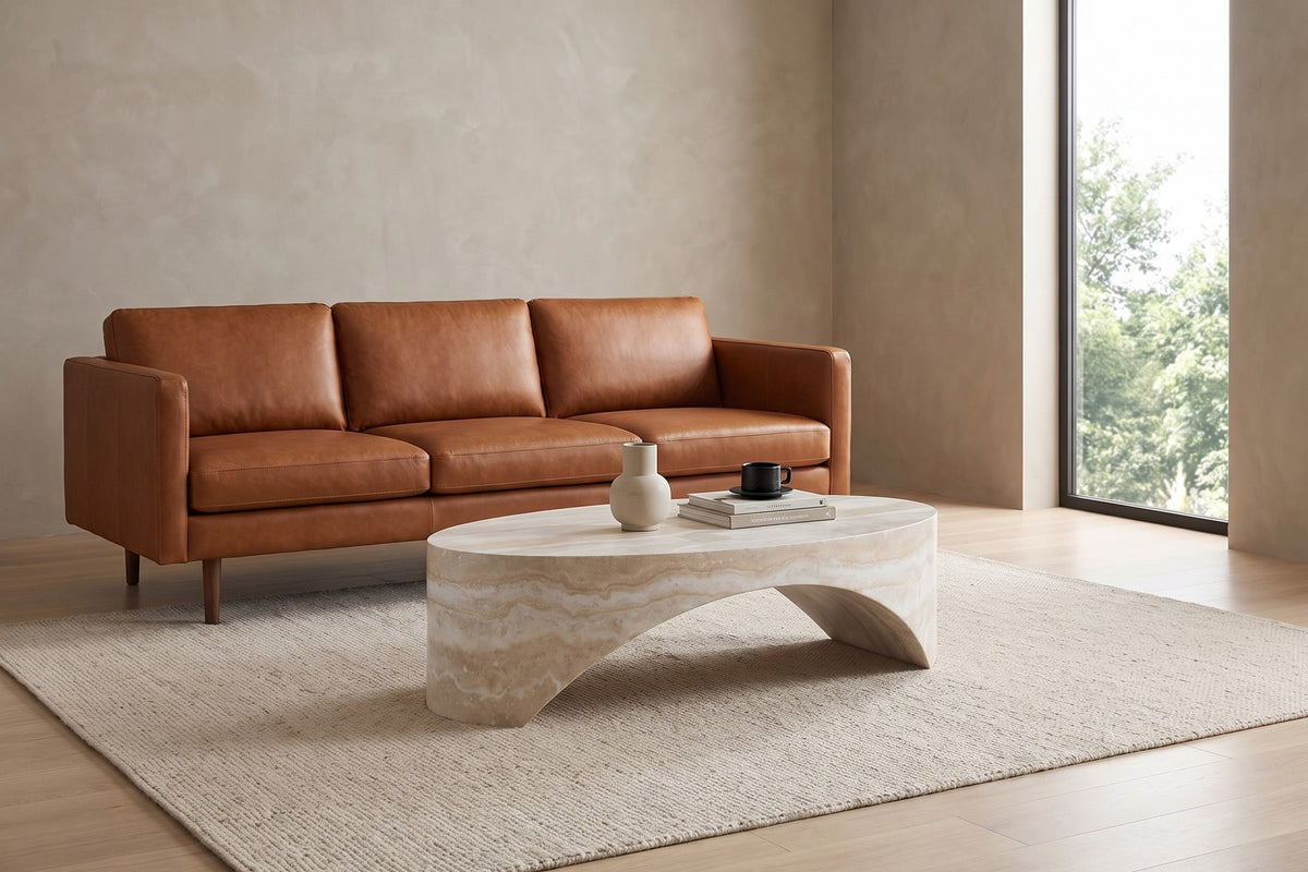 Alma Oval Sculpted Coffee Table – Travertine-Look Fiberglass, 43"