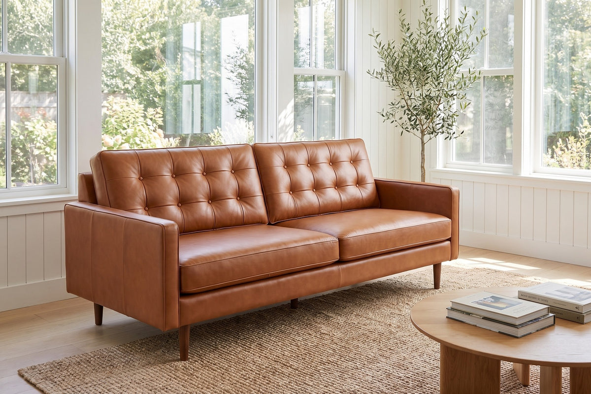 Amboise Cognac Button-Tufted Leather Sofa in a room