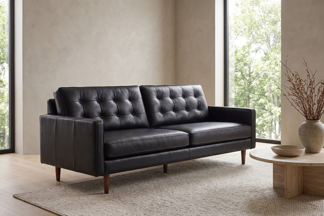 Amboise Button-Tufted Leather Sofa in Black, in a living space