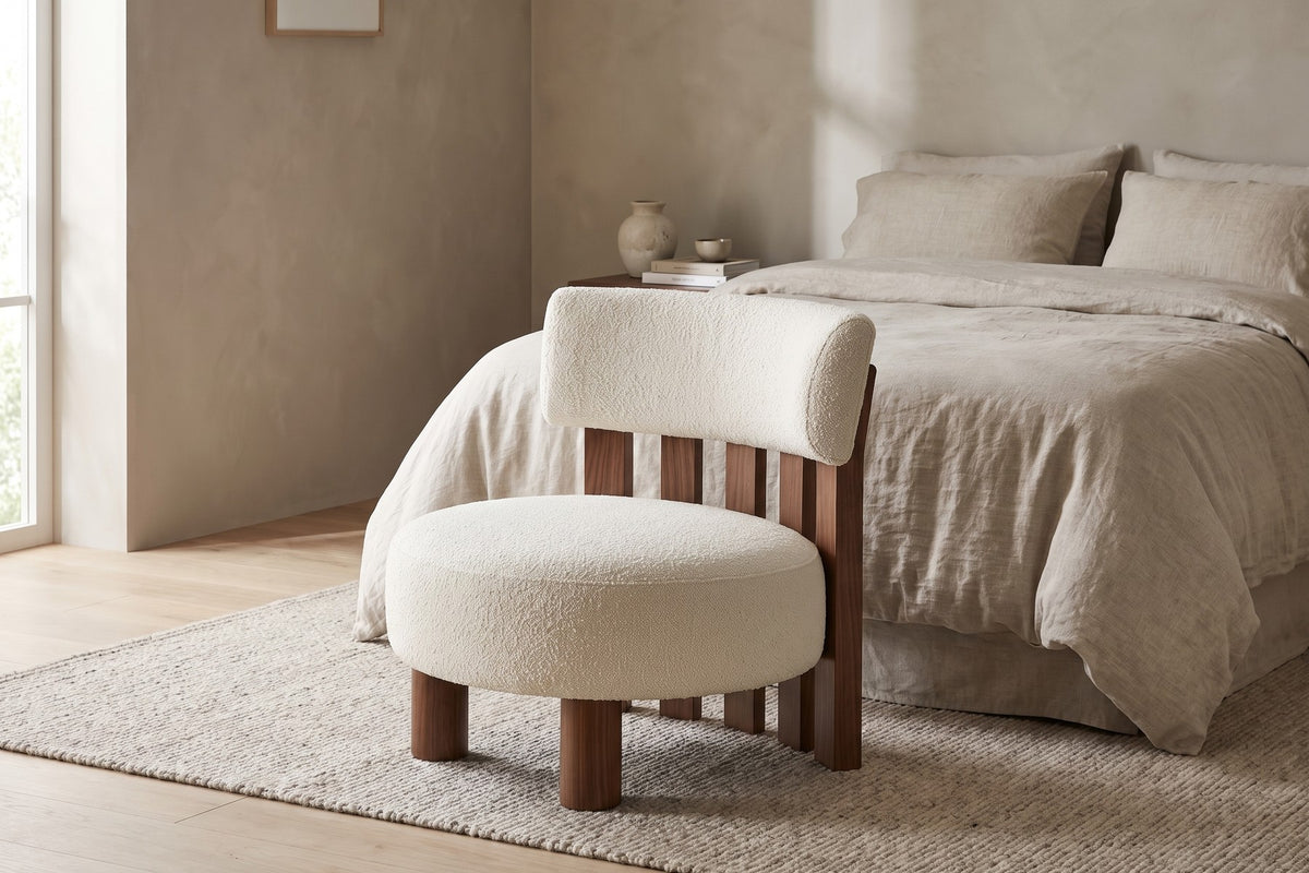 Bedroom. Beside the bed, an armless seat for getting dressed, its slatted back on show.