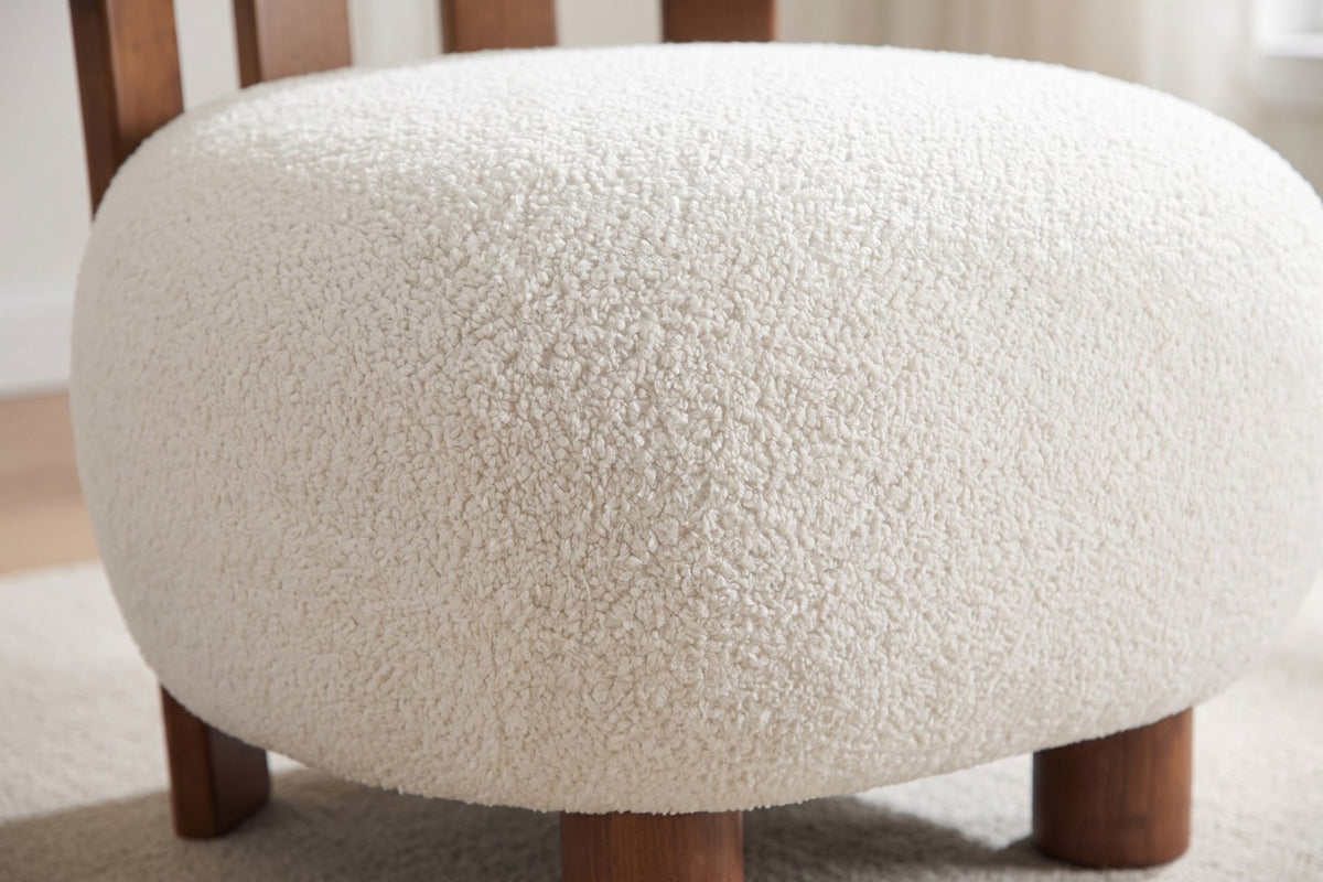 Close-up of the off-white boucle texture on the round seat (Anouk)