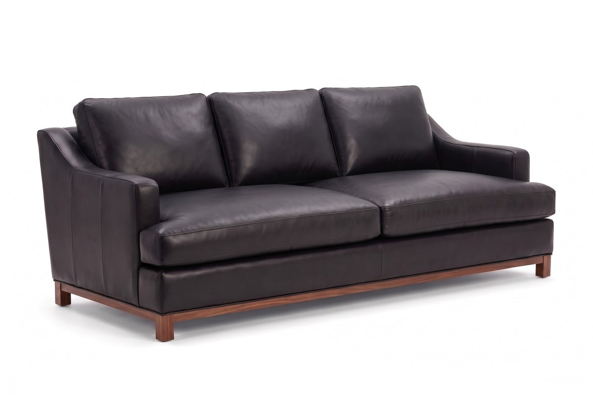 Arcachon Deep Leather Sofa in Black, three-quarter view on white