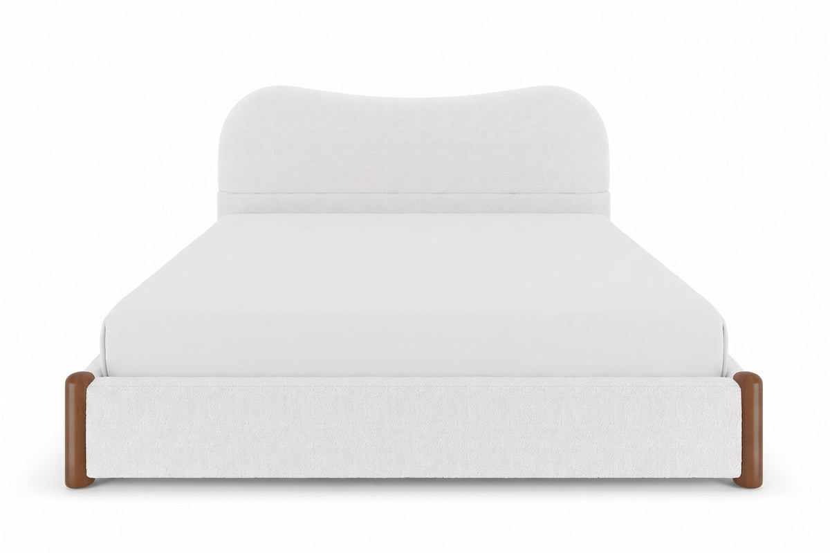 Aurore white Berber fleece king bed with a wavy headboard and walnut-finish feet, straight front view from the foot of the bed, slightly above mattress height on a white background