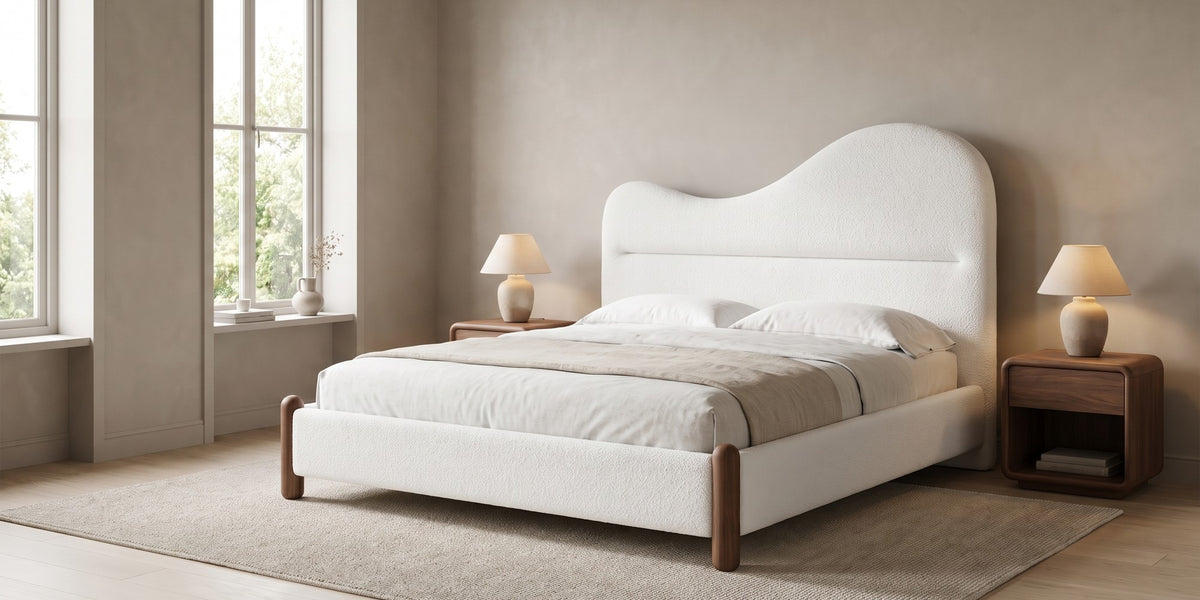 Aurore white Berber fleece king bed with a wavy headboard and walnut-finish feet in a wide, calm bedroom