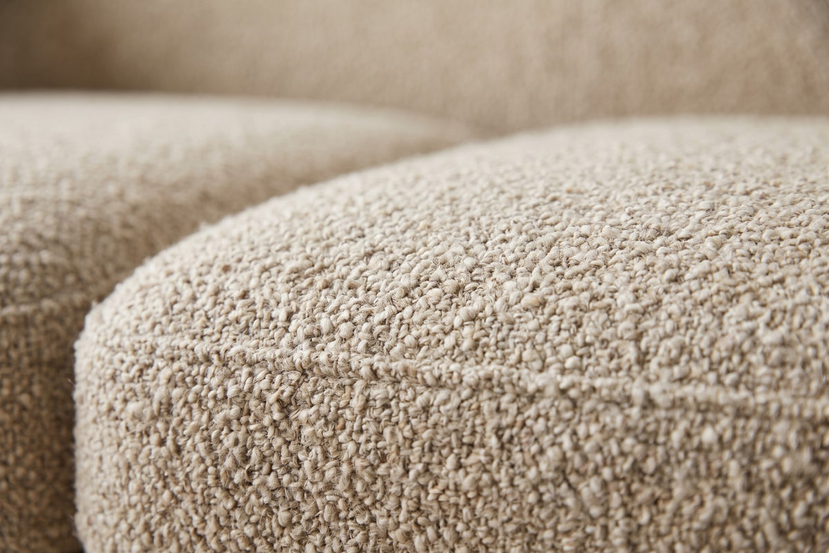 Close-up of the almond boucle texture on the seat cushions (Auteuil)