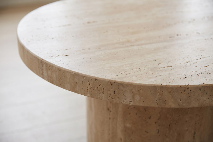 Bandol Travertine Coffee Table: close-up of the thick rounded end of the honed travertine top, showing its natural small pores and soft veining