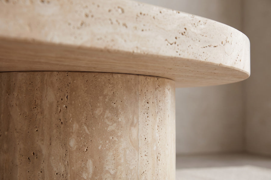 Bandol Travertine Coffee Table: close-up of where a round travertine drum base meets the underside of the top