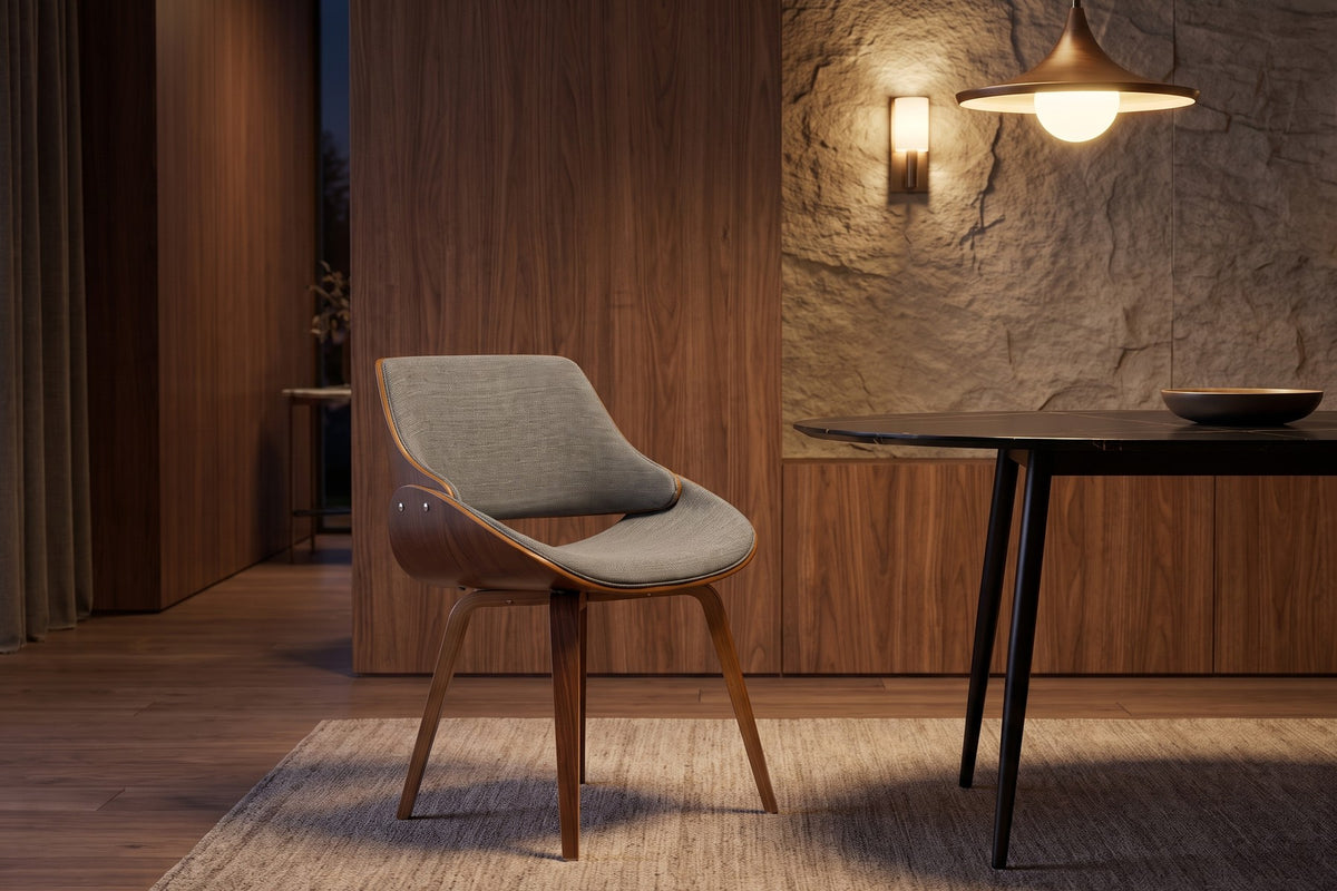A Bastien walnut bentwood chair at the Marais table in a warm evening dining room