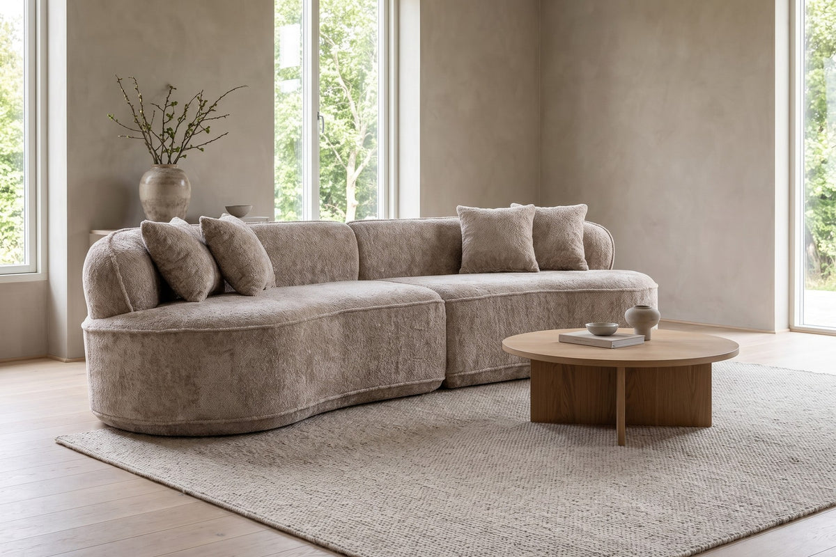 Bastille camel bouclé curved two-piece sectional in a wide, calm living room