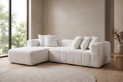 Batignolles white bouclé grid-tufted l-shaped sectional with left-facing chaise in a calm, daylit living room