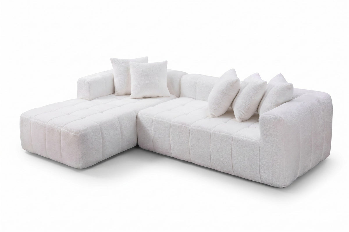 Batignolles white bouclé grid-tufted l-shaped sectional with left-facing chaise, three-quarter view on a white background
