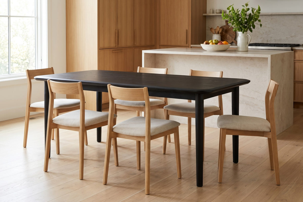 Beaune Dining Table in Black Oak, in a room setting