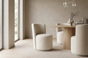 Bérénice ivory bouclé swivel dining chair, set of 2 in a calm, daylit dining room