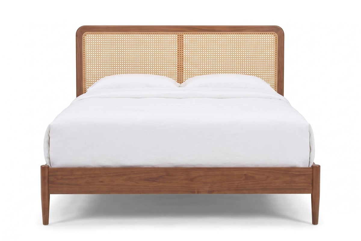 Bergerac Walnut and Cane Bed, straight front view of the headboard from the foot of the bed, at mattress height