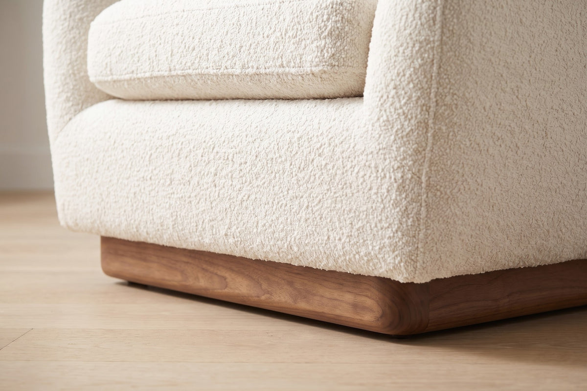 Biot Bouclé Lounge Chair – Sculpted Curved Shell, Low Walnut Plinth