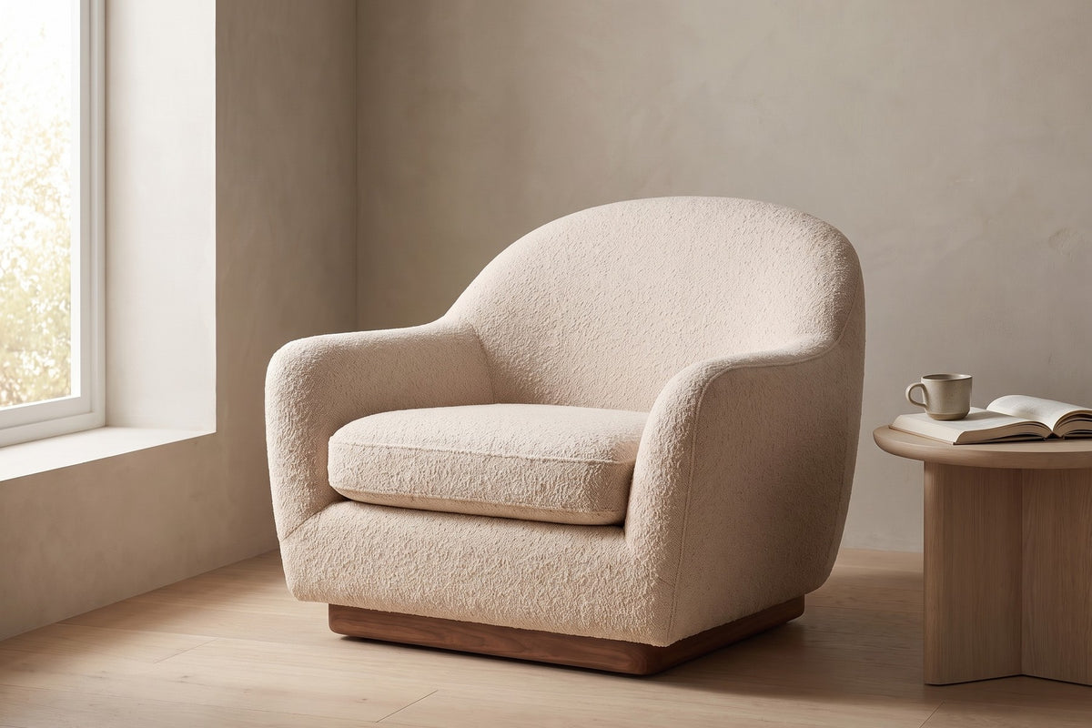 Biot Bouclé Lounge Chair – Sculpted Curved Shell, Low Walnut Plinth