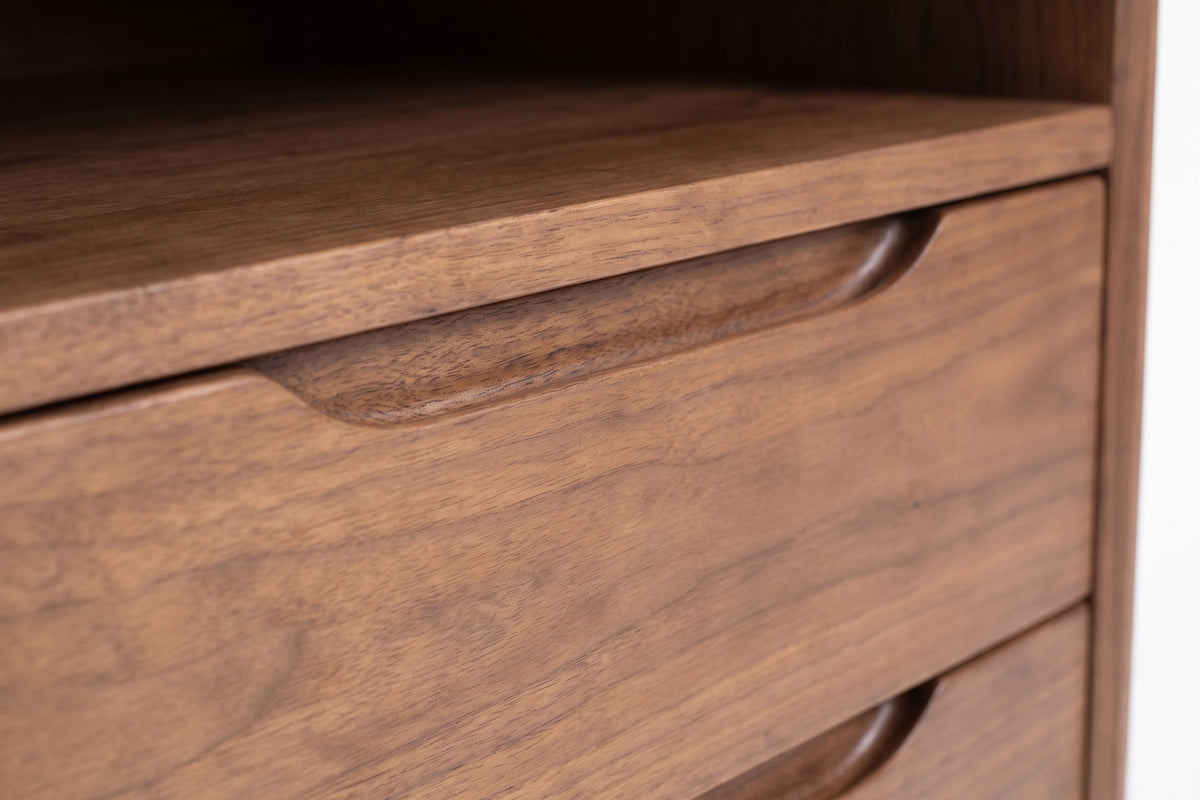 Bonnieux Walnut Nightstand: close-up of the carved scooped finger pull along the top edge of a walnut drawer front, showing the grain