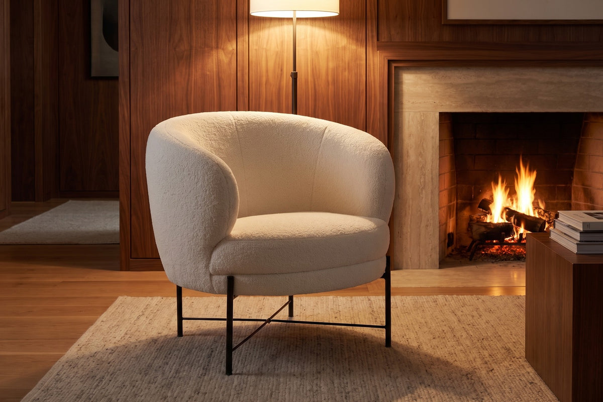 By the fire. White sherpa catches the warm light, and the slim base keeps it airy.
