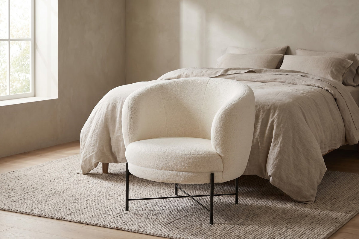Camille sherpa barrel chair at the foot of a bed in a calm bedroom