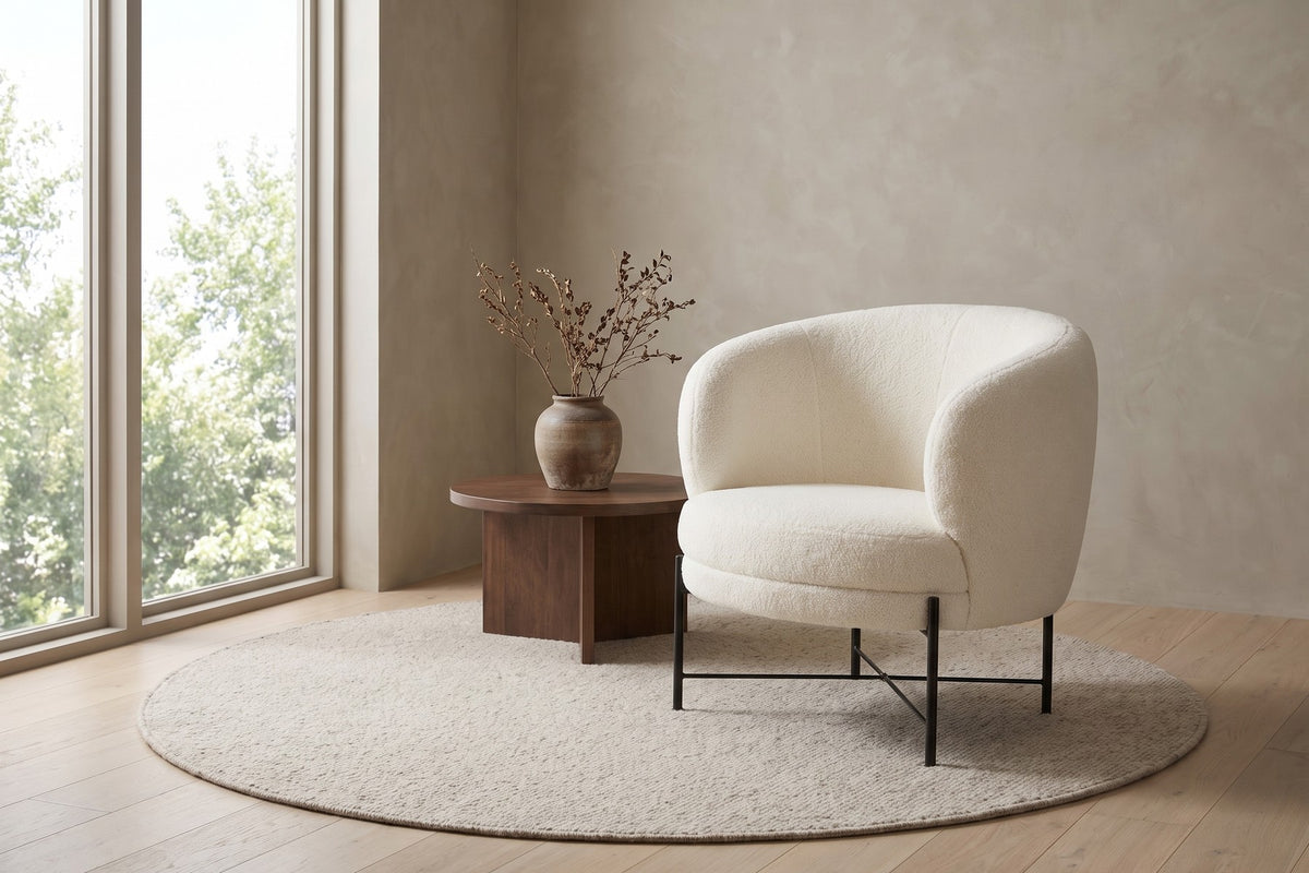 Camille white sherpa barrel accent chair in a calm daylit living room