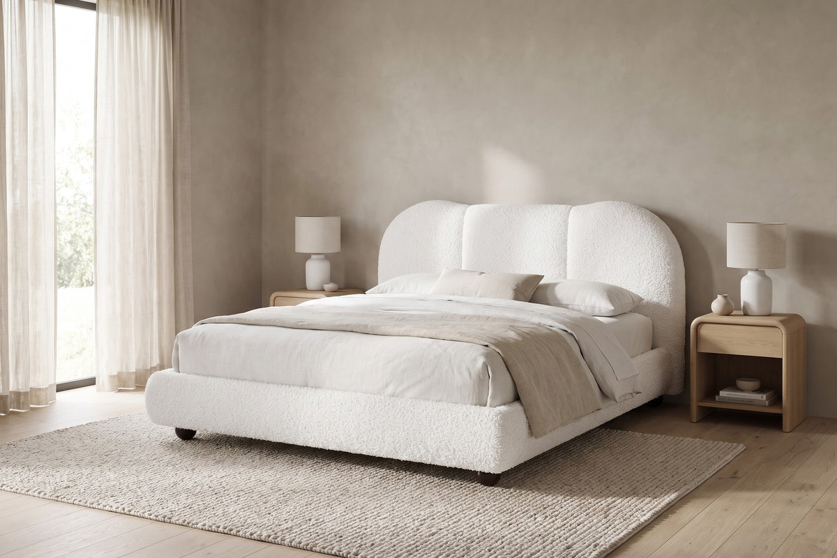 Celeste white bouclé platform bed with a cloud headboard in a calm, daylit bedroom