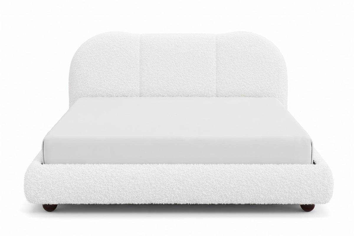 Celeste white bouclé platform bed with a cloud headboard, straight front view from the foot of the bed, at mattress height on a white background