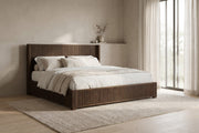 Chaillot fluted walnut-finish wood platform bed, king in a calm bedroom with greige plaster walls and a pale oak floor