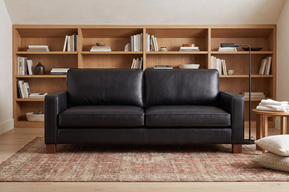 Chamonix Leather Sleeper Sofa in Black, in a room setting