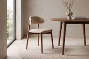 Charonne light camel upholstered dining chair with walnut-finish frame, set of 4 in a calm, daylit dining room