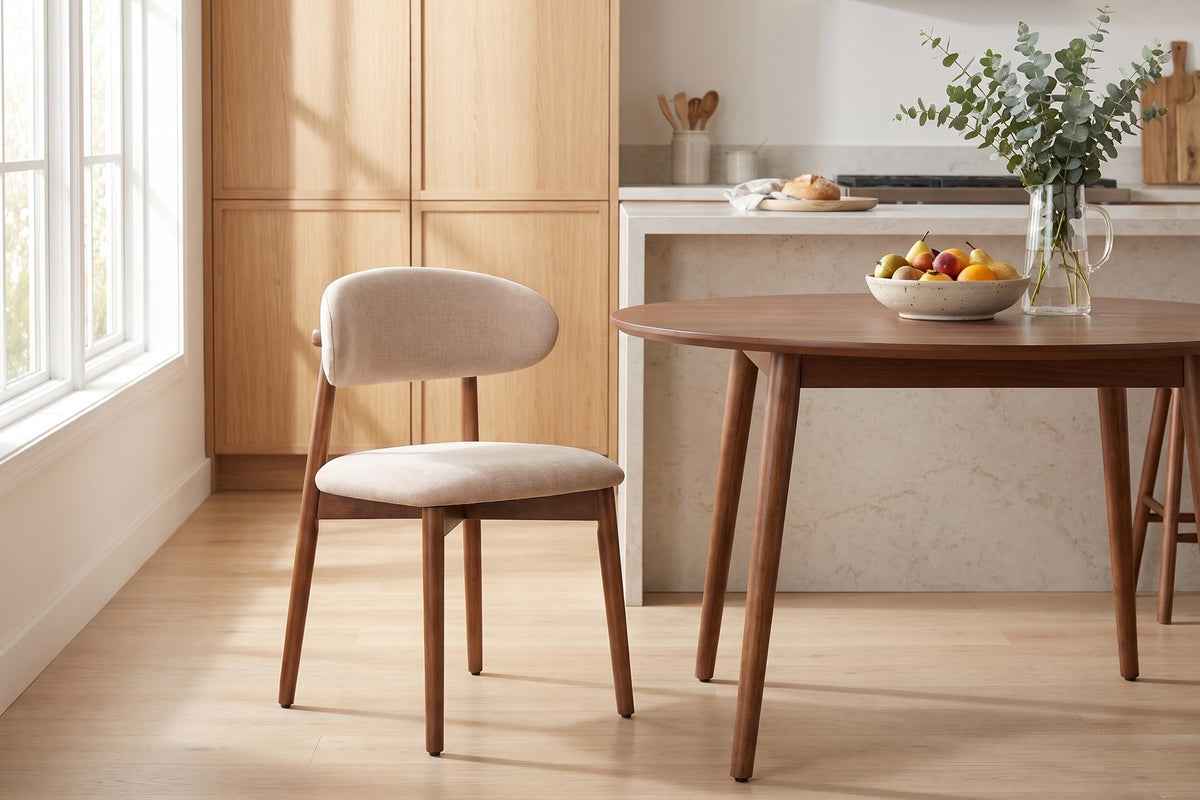 Charonne light camel upholstered dining chair with walnut-finish frame, set of 4 in a bright open-plan kitchen and dining space