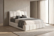 Clémence white boucle channel-tufted king platform bed in a calm bedroom with greige plaster walls and a pale oak floor