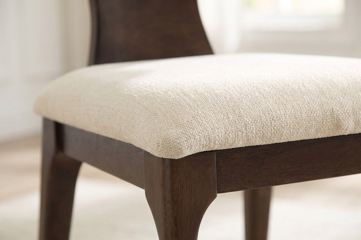Close-up of the beige chenille seat where it meets the wood frame