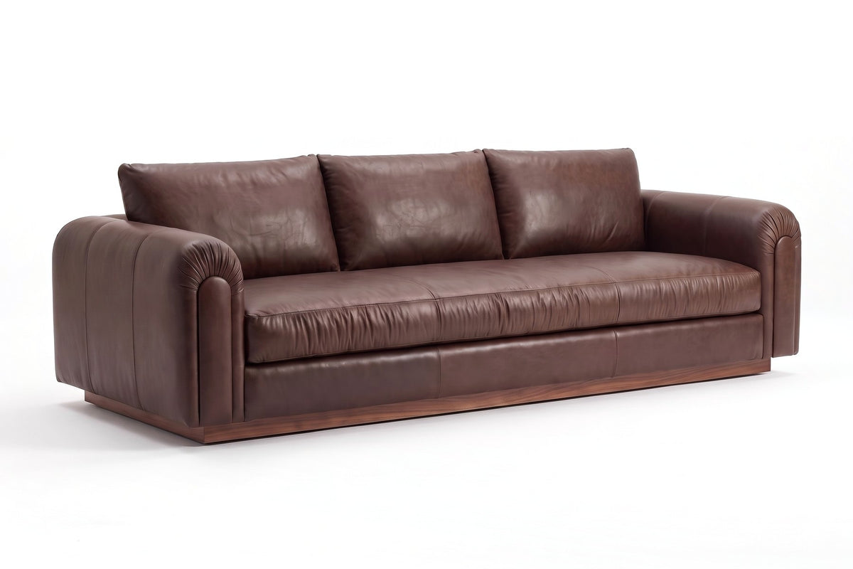 Collioure 88" Low Leather Sofa – Gathered Arms, Bench Seat, Walnut Plinth