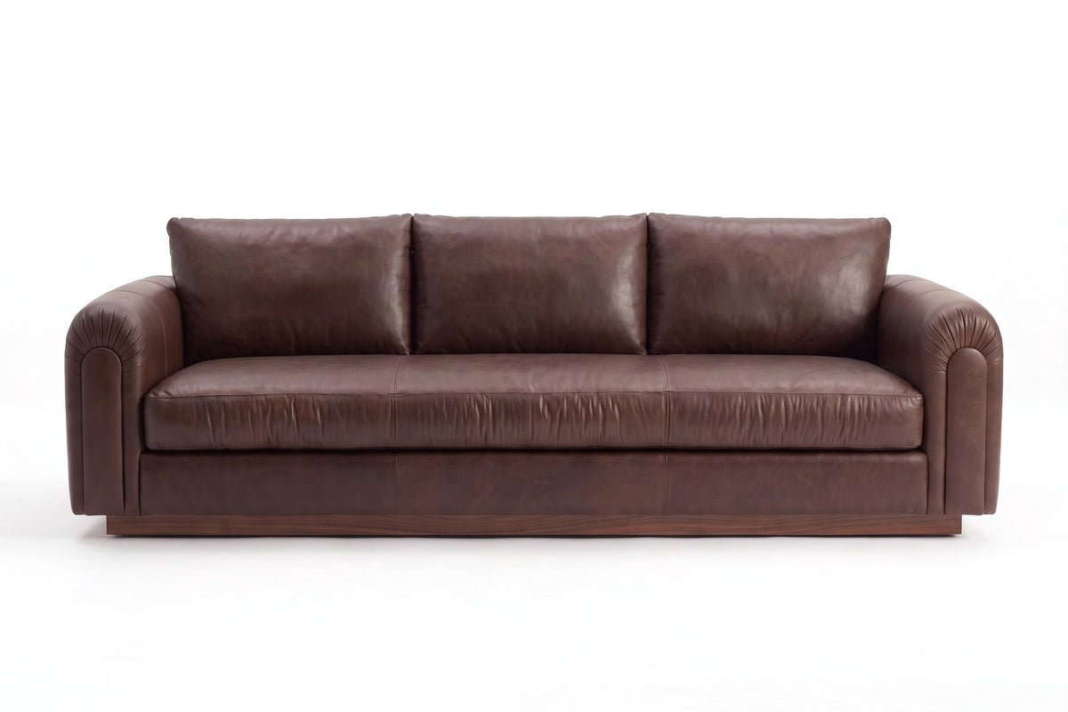 Collioure 88" Low Leather Sofa – Gathered Arms, Bench Seat, Walnut Plinth