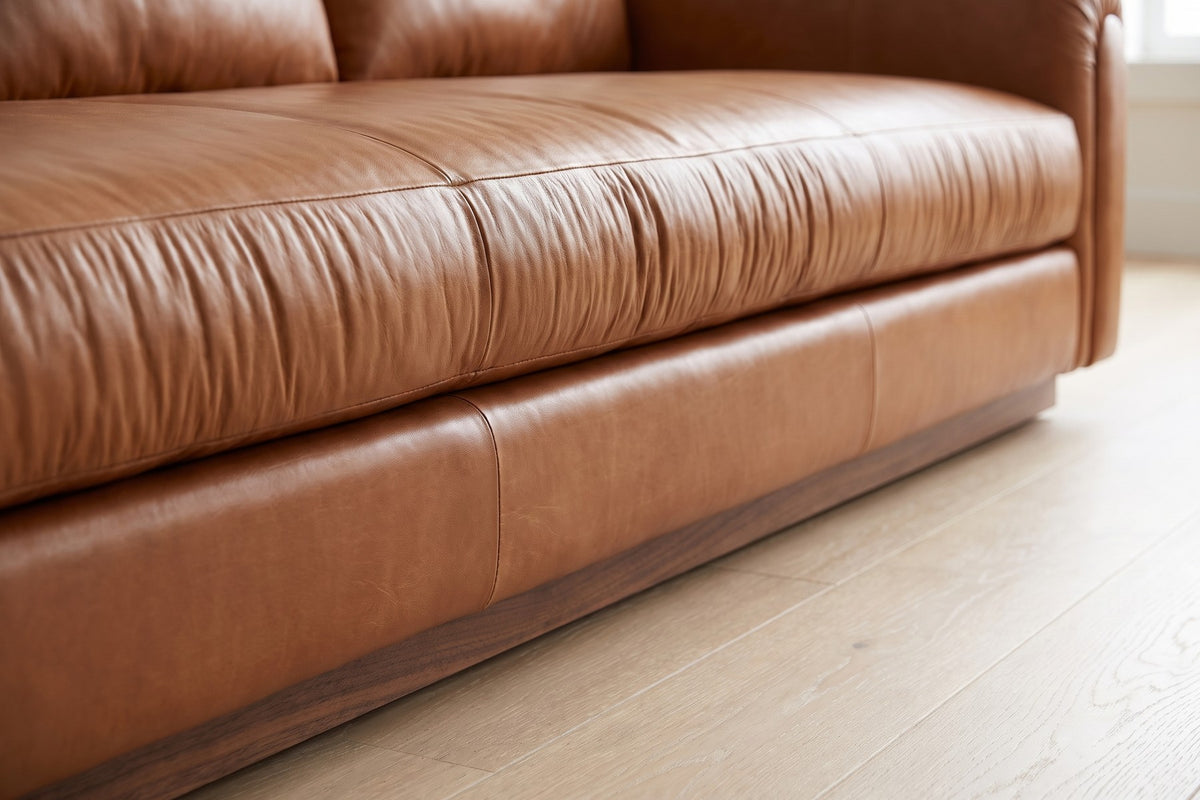 Collioure 88" Low Leather Sofa – Gathered Arms, Bench Seat, Walnut Plinth