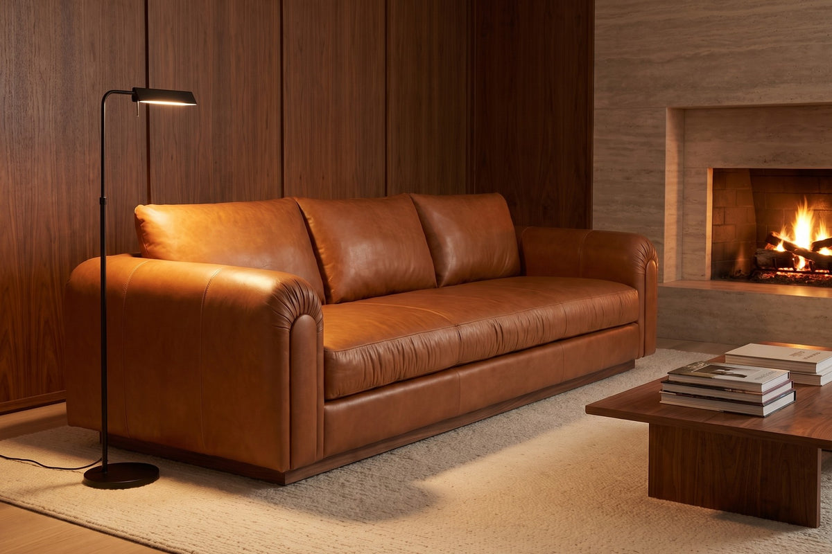 Collioure 88" Low Leather Sofa – Gathered Arms, Bench Seat, Walnut Plinth