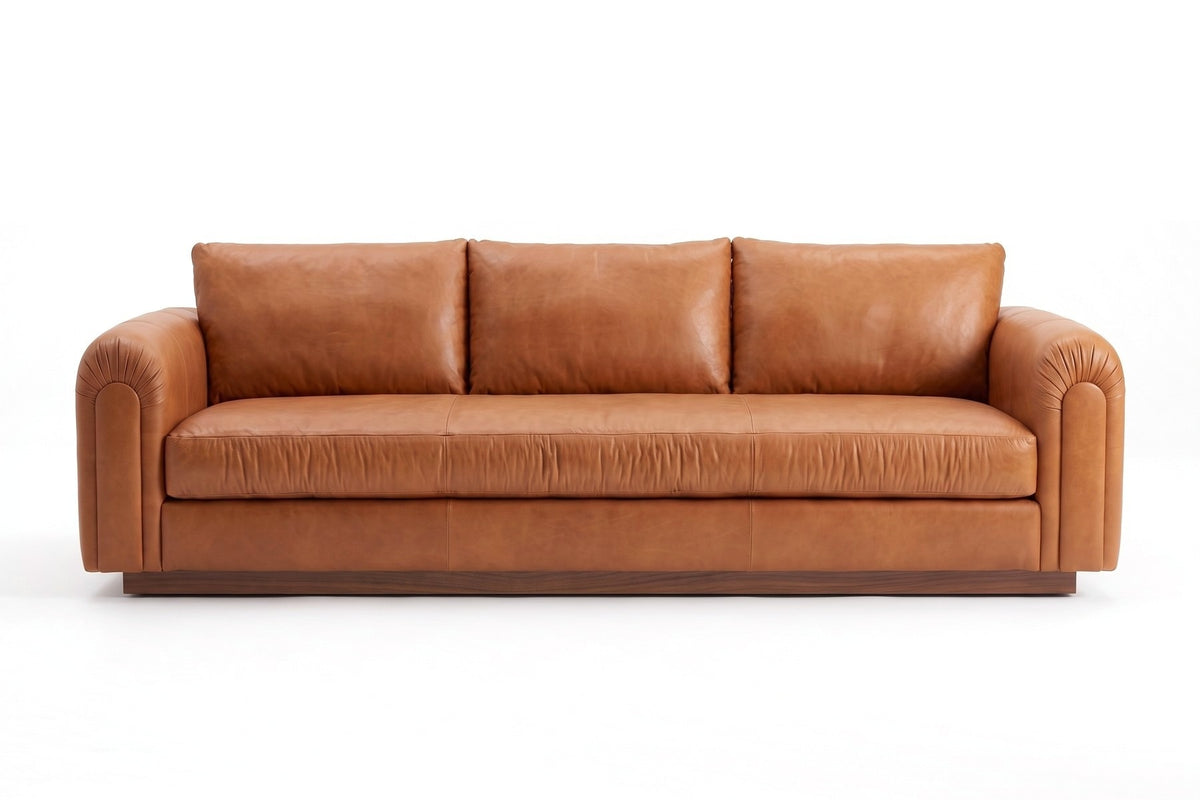 Collioure 88" Low Leather Sofa – Gathered Arms, Bench Seat, Walnut Plinth