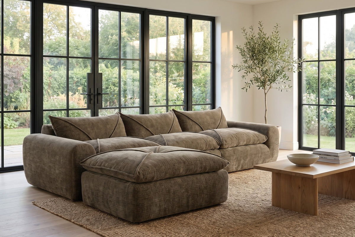 Concorde 116" brown chenille modular sectional with movable ottoman in a bright sunroom-style living room