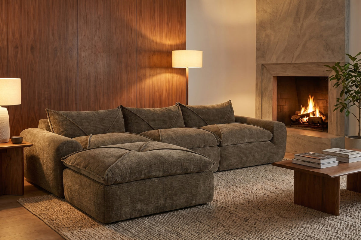 Evening. By the fire, the deep cushions and ottoman make one big place to lounge.
