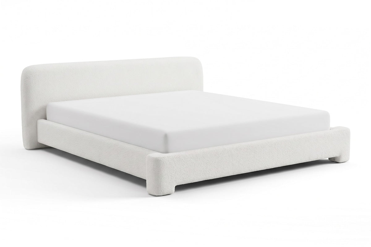 Elodie low white bouclé platform bed with rounded rails, three-quarter front view from slightly above on a white background