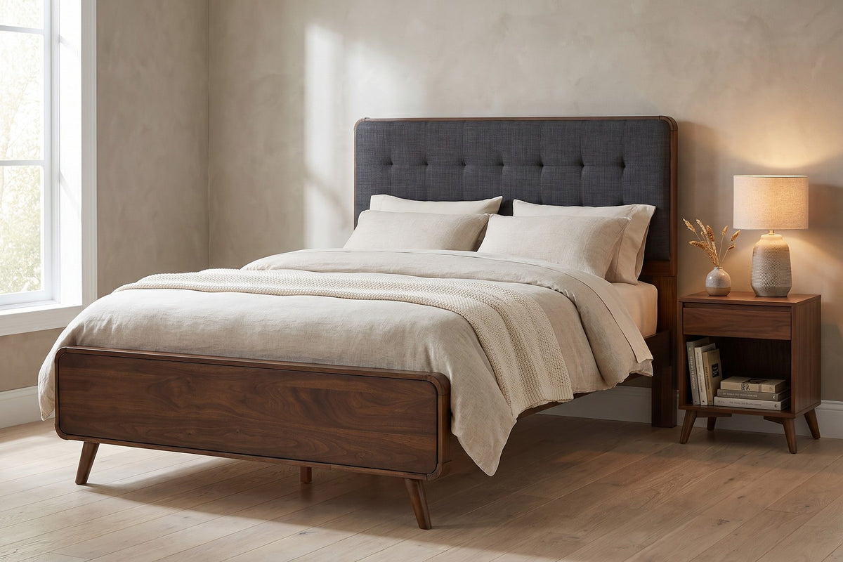 Étoile queen mid-century walnut platform bed with charcoal tufted headboard in a calm bedroom in soft morning light, beside the bed