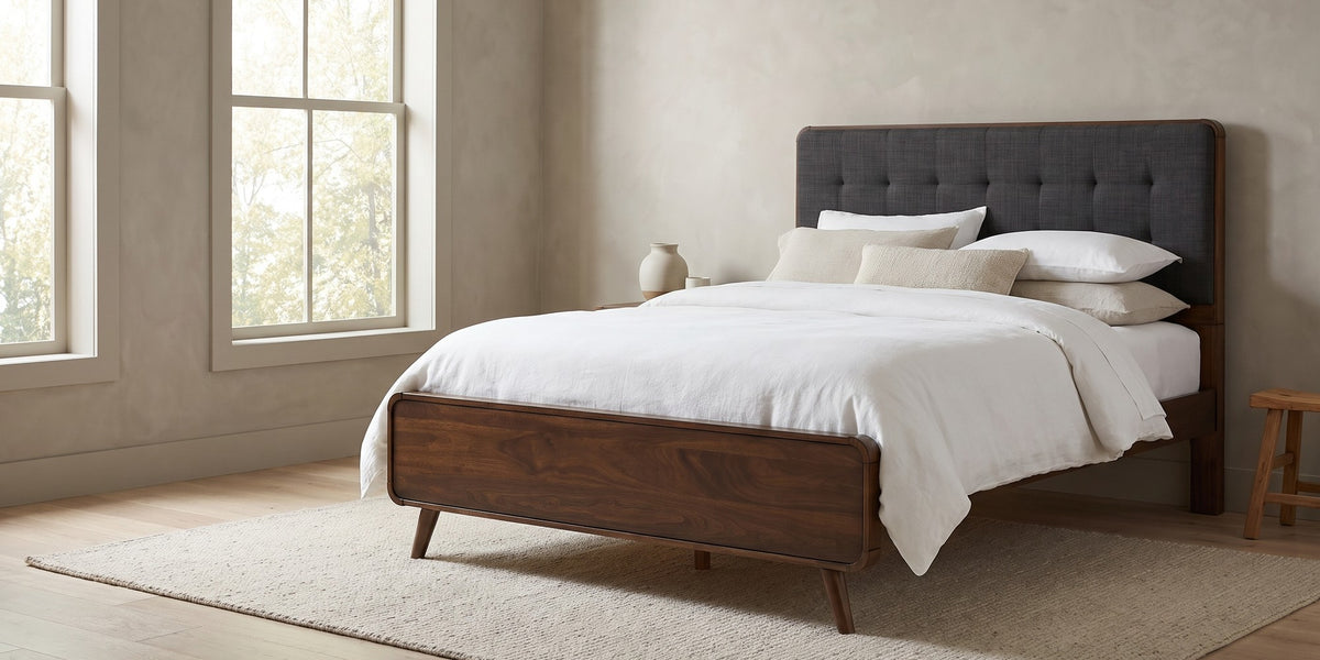 Étoile queen mid-century walnut platform bed with charcoal tufted headboard in a wide room view