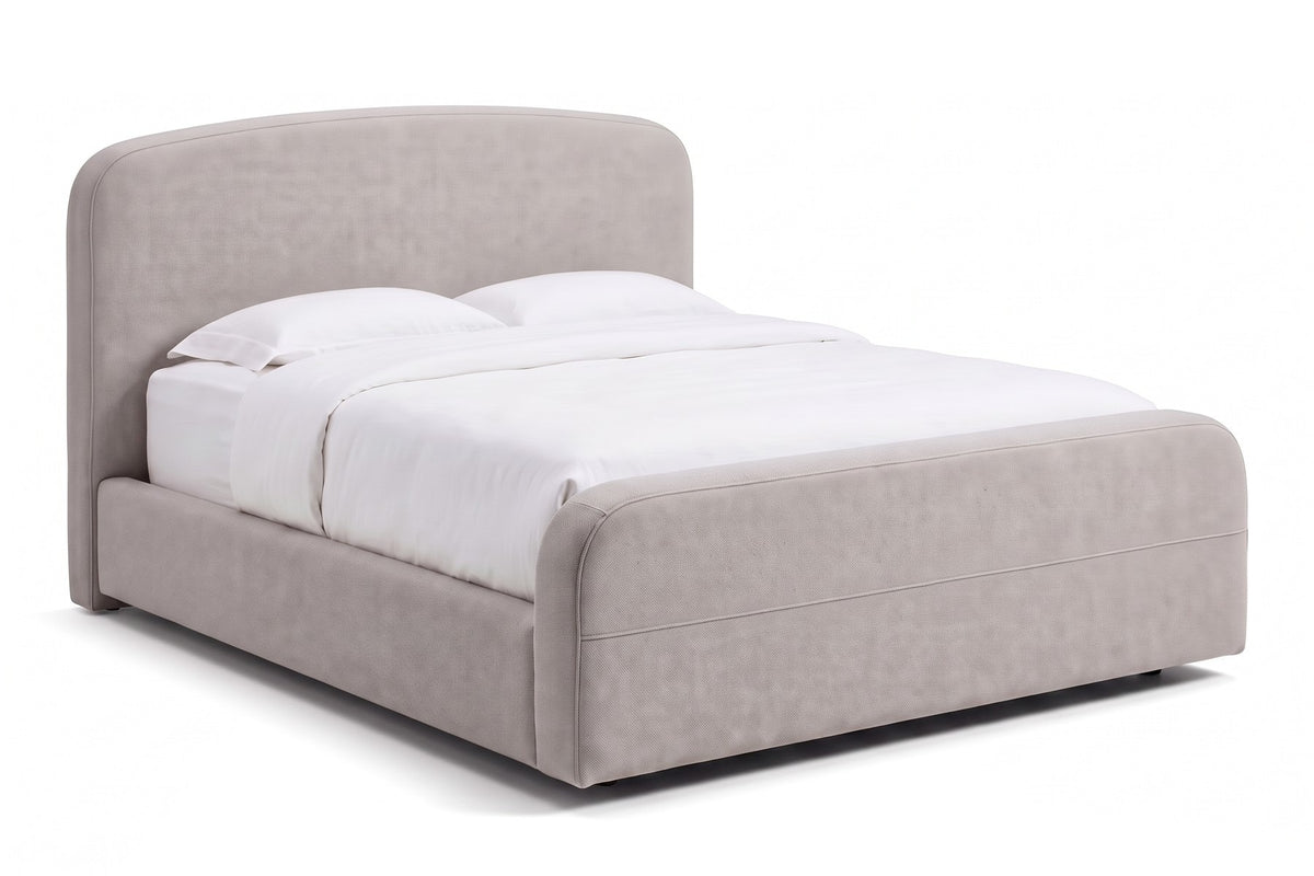 Giverny Upholstered Low Bed in Stone, three-quarter view on white