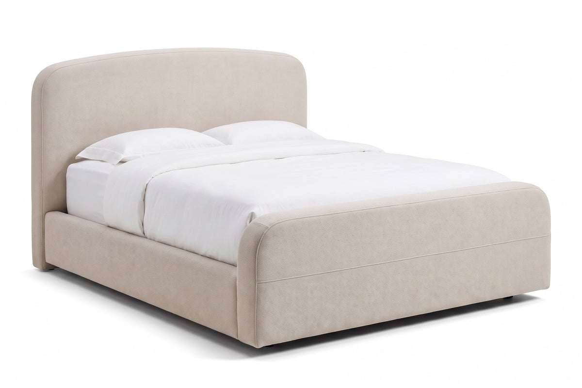 Giverny Oatmeal Upholstered Low Bed, three-quarter view from the foot of the bed at the left corner, slightly above mattress height
