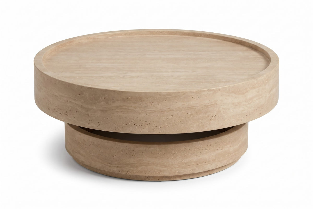 Haussmann 31.5" round drum coffee table with a travertine-look finish, three-quarter view on a white background